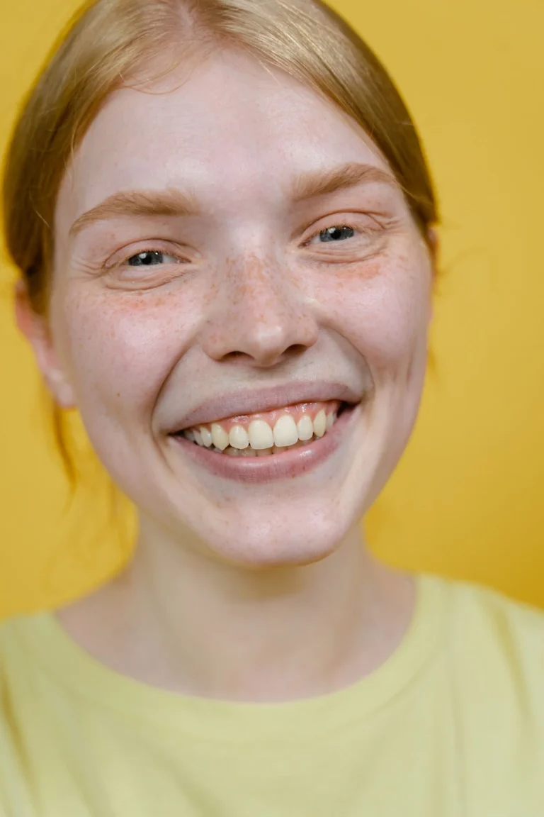 How long do veneers last shown with porcelain veneer samples held by a cosmetic dentist